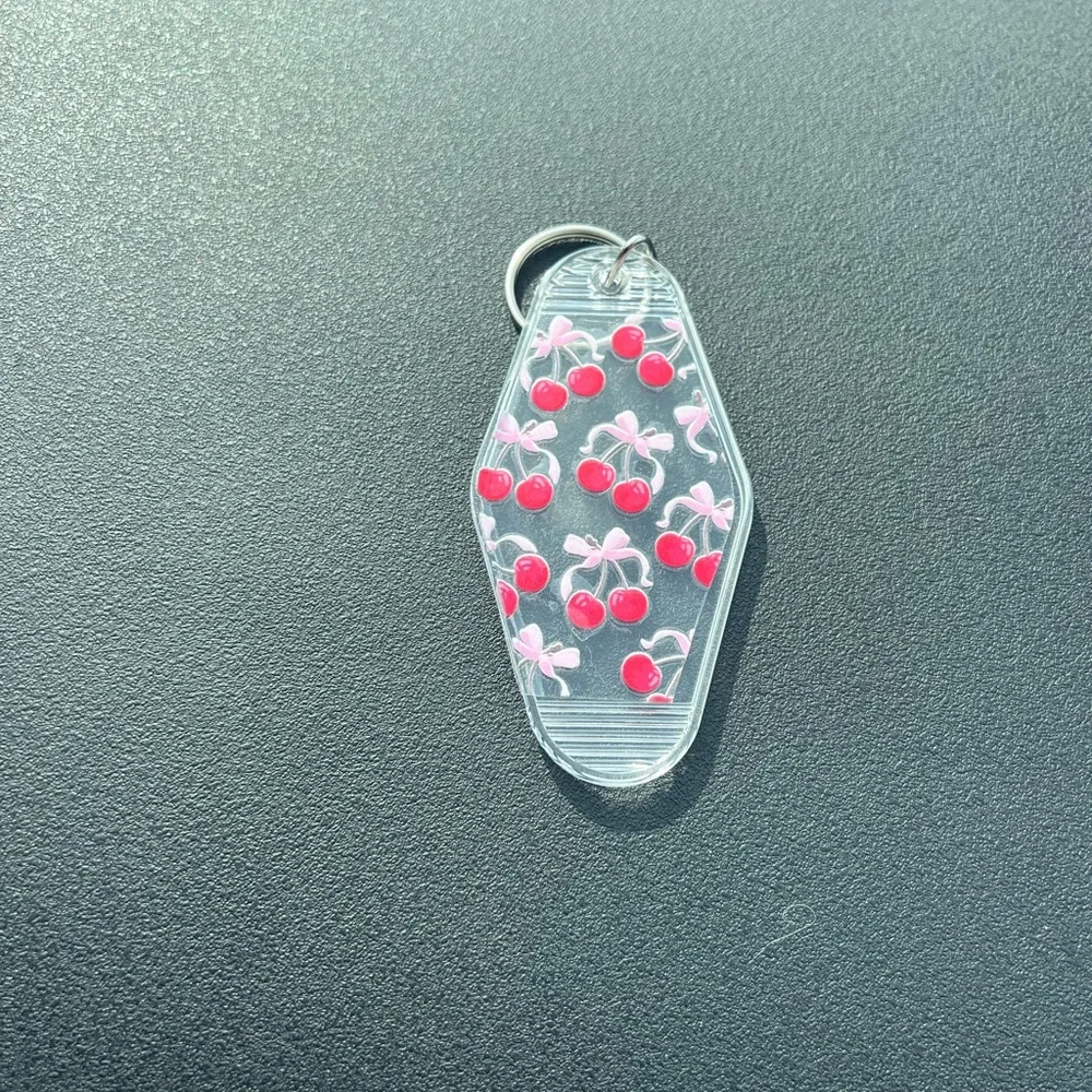 Adorable cherry keychain with bows